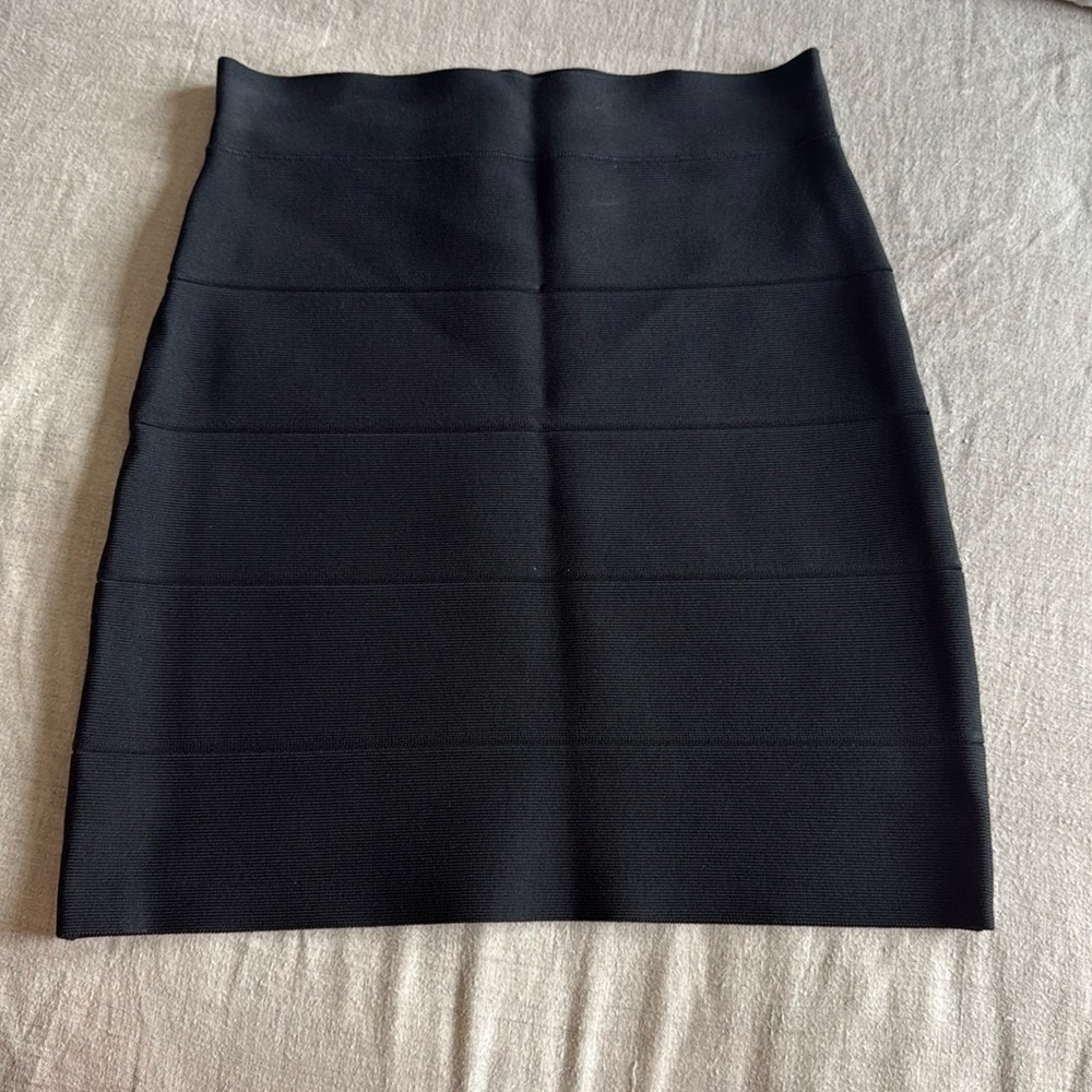 This item is a classic BCBGMAXAZRIA black bandage mini skirt.